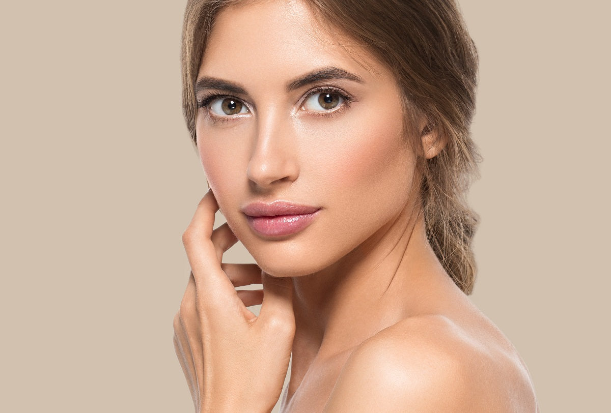 Woman with beautiful face and healthy, glowing skin